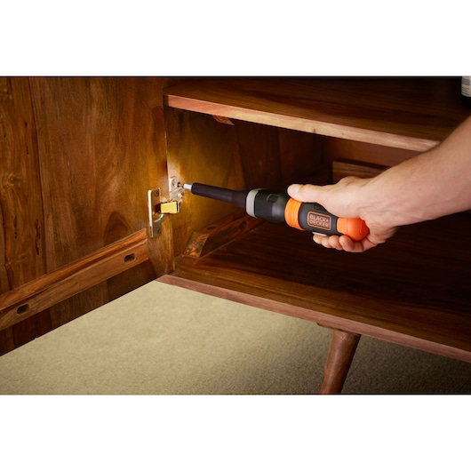 BLACKDECKER BCF601C cordless screwdriver used to fix cabinet hinge.