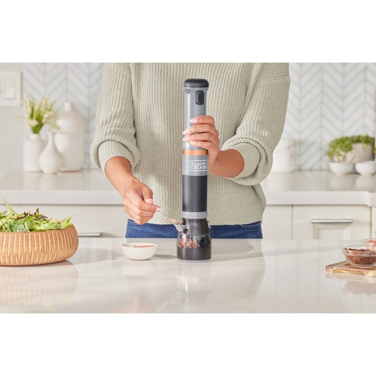 Photo of BLACKDECKER BCKM1012KG electric spice grinder in use on kitchen counter.
