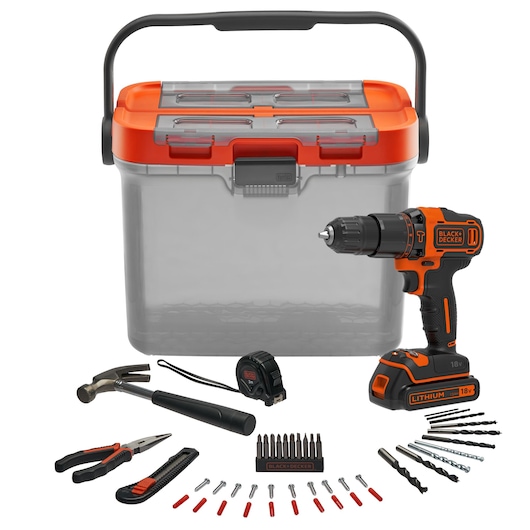 A BLACK+DECKER photography kit featuring a storage box, cordless drill, hammer, tape measure, pliers, utility knife, drill bits, screwdriver bits, and assorted accessories arranged in front of the box.