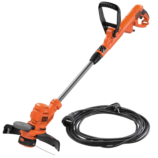 An orange and black BLACK+DECKER electric grass trimmer with a long handle and a black extended power cord coiled beside it.