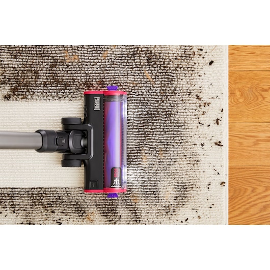 BLACKDECKER BHFEA640WP vacuum cleaner head cleaning dirty rug from top angle.