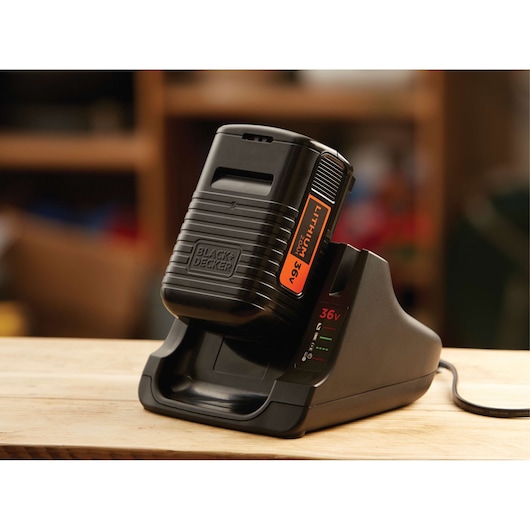 BLACKDECKER BL20362 lithium 36V battery charger, black, close-up on wooden table.