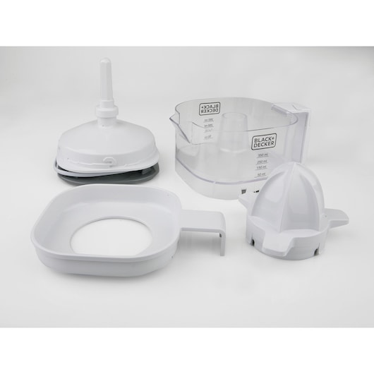 Photo of BLACK+DECKER BXCJ25E citrus juicer disassembled, showing white plastic parts and a transparent juice container, front angle.