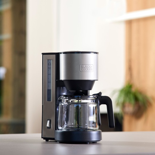 BLACKDECKER BXCO870E drip coffee maker with glass carafe on countertop, front angle.