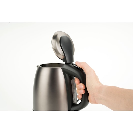 BLACKDECKER BXKE2202E stainless steel electric kettle side view with open lid and hand holding handle.