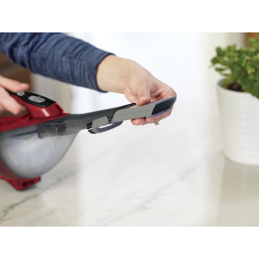 BLACKDECKER DVA315J handheld vacuum nozzle close-up on marble surface.