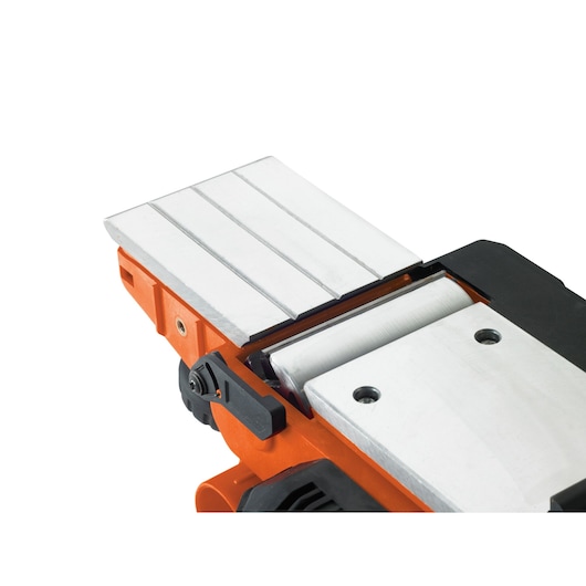 BLACKDECKER KW750K planer close-up with metal base plate and adjustment knob, angled view on white background.