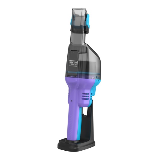 BLACK+DECKER NVD220BP handheld vacuum in purple and blue, side angle, on charging base, white background.